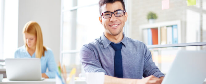 stock photo young man at laptop