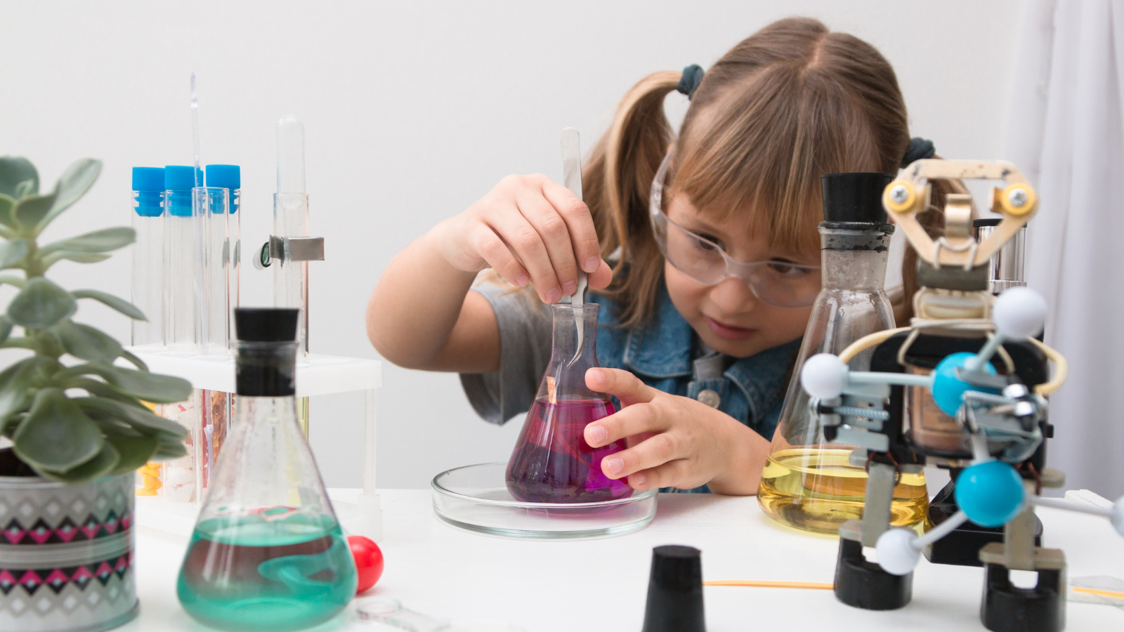 Young girl participating in a science activity
